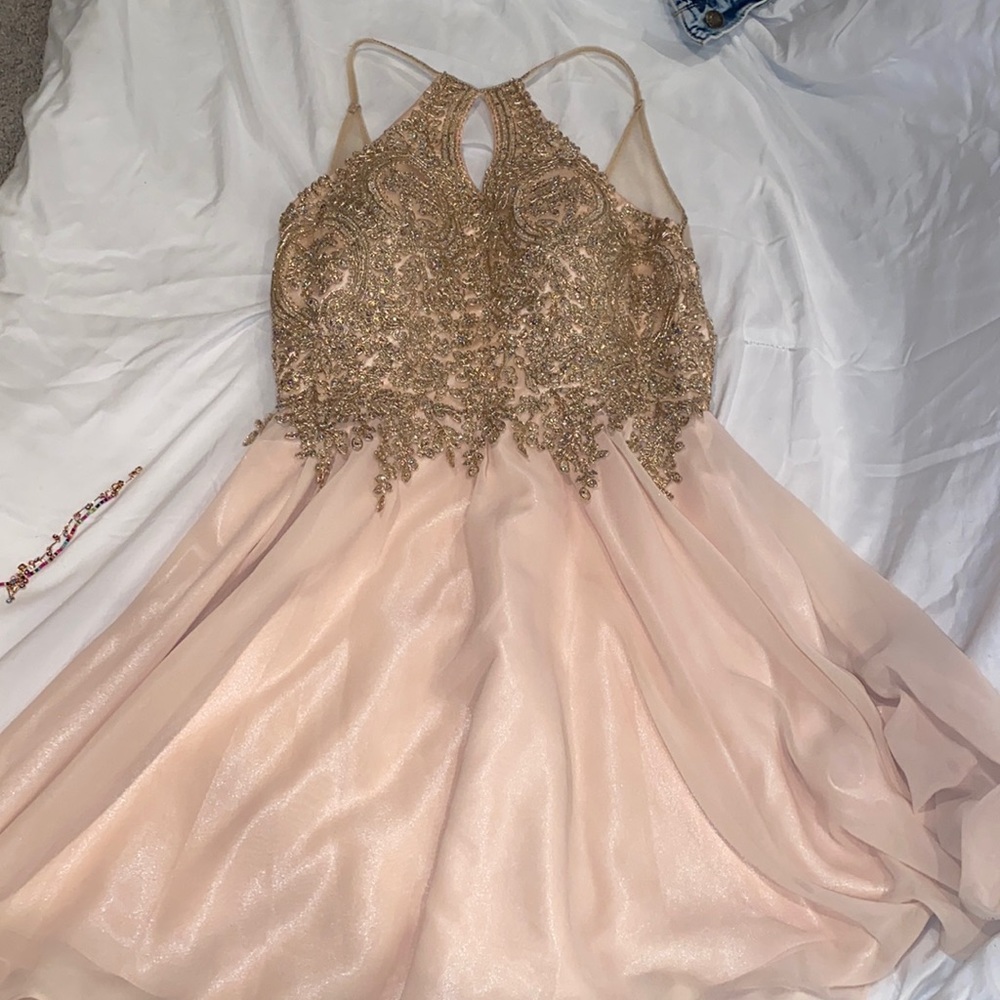 It is a tan dress, the chest area is kind of big.